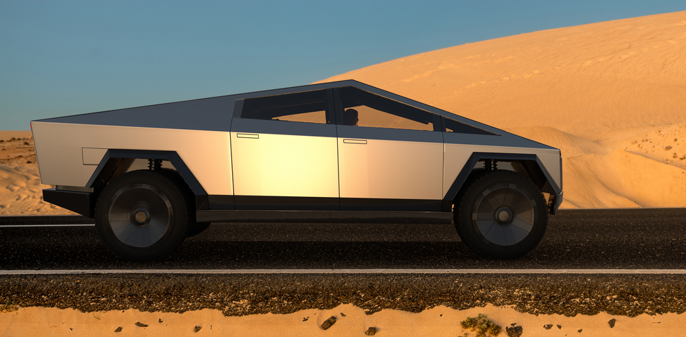 Tesla Cybertruck na asfaltowej pustynnej drodze