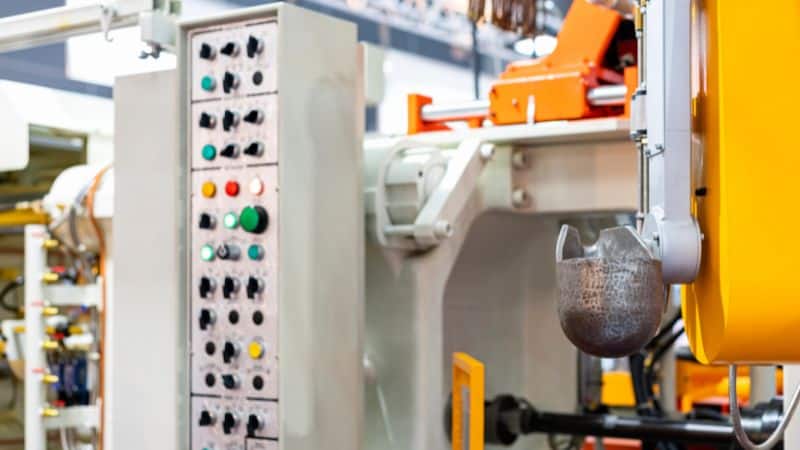 a high pressure die casting machine with a control panel