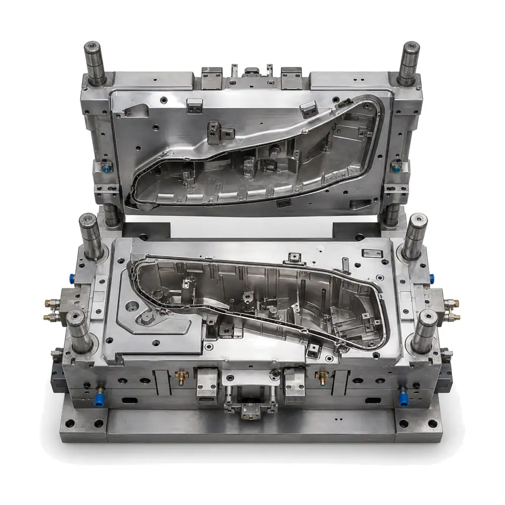 Precision injection mold for custom headlight housing manufacturing, showcasing detailed metal tooling components used in automotive lighting production.