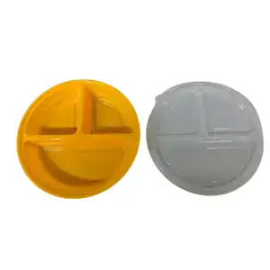 Round plastic food storage containers with divided compartments, one yellow and one clear, ideal for meal prep and portion control.