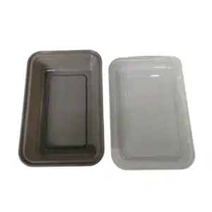 Set of two rectangular food storage containers, one black and one clear, ideal for kitchen organization and meal prep.