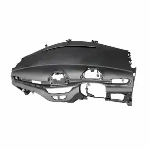 Automotive dashboard frame for vehicle repair, black plastic with mounting points and cutouts for instruments and controls.
