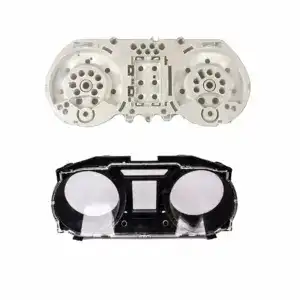 Injection mold for automotive dashboard instrument cluster with detailed cavities for gauges and display.