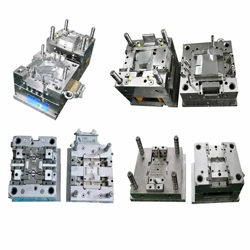 Collection of automotive dashboard instrument cluster injection molds in various shapes and sizes for manufacturing.