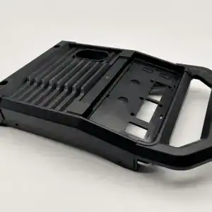 Injection mold for automotive control panel, showcasing detailed cavity and structural features for manufacturing precision.
