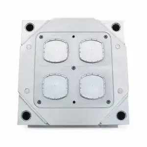 High-precision four-cavity rounded-square IML closure mould for plastic injection molding, showcasing detailed cavity design and durable construction.