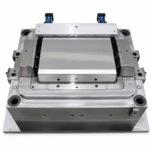 High-precision industrial mold die used in manufacturing processes, made of durable metal with detailed components for accurate shaping and forming.