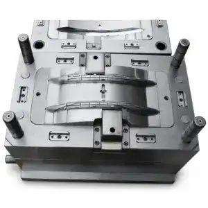 Close-up of a twin-cavity curved refrigerator handle mold showing detailed metal cavity design and construction.