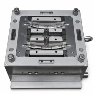 Close-up of a precision metal mold used in manufacturing processes, featuring detailed components and metallic surfaces.