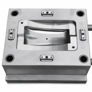 Close-up of a metallic industrial mold used in manufacturing processes, showcasing precise metalwork and sturdy construction.