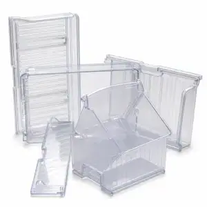 Set of transparent plastic storage bins and containers for organizing household or office items.