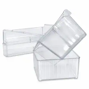 Transparent stackable refrigerator storage bins with lids, ideal for organizing food and beverages efficiently in the fridge.