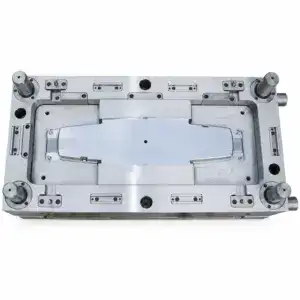 High-precision industrial mold die used in manufacturing processes, featuring multiple mounting points and a central cavity for shaping materials.