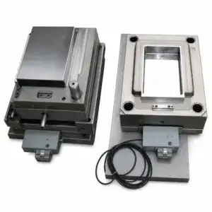 High-precision metal mold components for industrial manufacturing, featuring detailed machining and electrical wiring for automation.