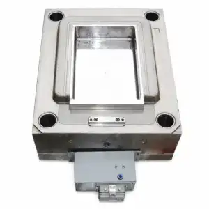Stainless steel industrial mold used in manufacturing processes, featuring a rectangular cavity and precise construction for high-quality production.