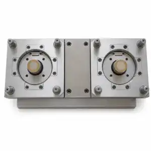 Close-up of a precision mechanical component with two circular parts and multiple screws, used in industrial machinery.