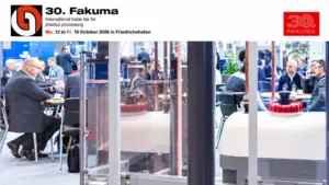 Moldie booth at Fakuma 2026 showcasing innovative plastic processing solutions with industry professionals and visitors.